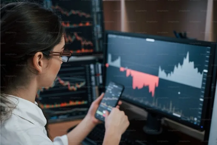 Professional trader analyzing market charts