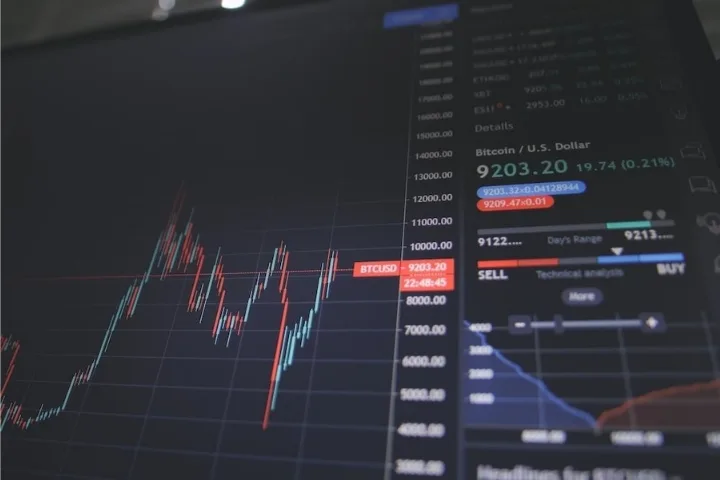 Student learning stock analysis on a laptop