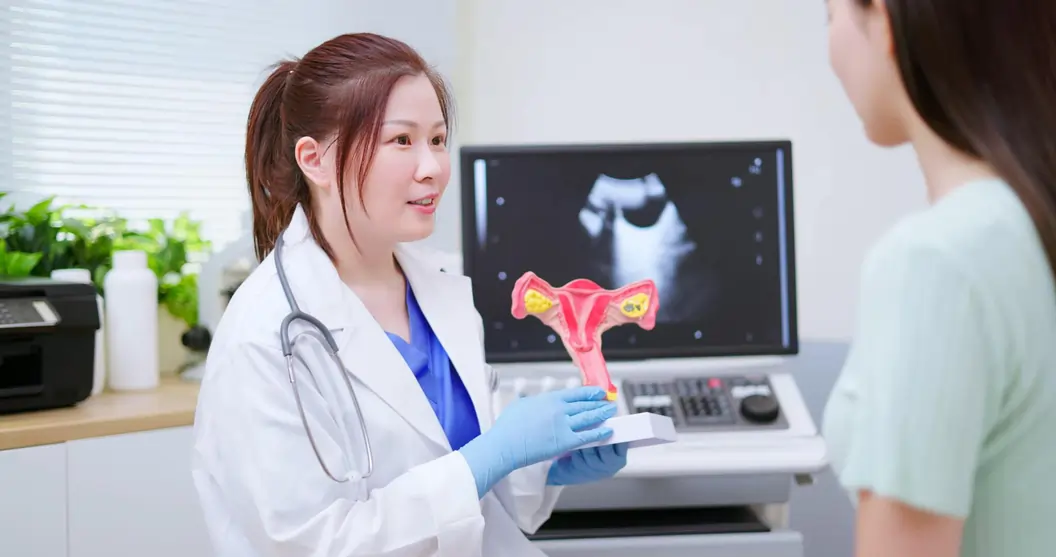 A gynaecologist talking about the PCOS to her patient